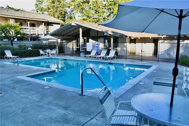 a view of a swimming pool with a patio
