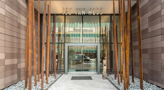 a living room with fireplace furniture and a large window