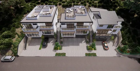 an aerial view of a house with garden and parking