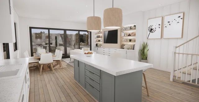 a view of kitchen island with stainless steel appliances refrigerator stove dining table and chairs
