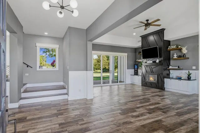a view of livingroom with furniture flat screen tv and staircase