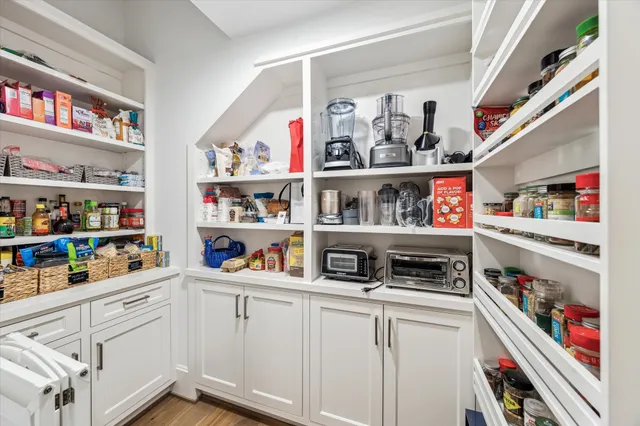 a kitchen with stainless steel appliances lots of different kinds of food