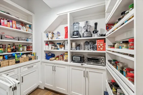 a kitchen with stainless steel appliances lots of different kinds of food