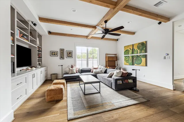 a living room with furniture fireplace and a flat screen tv