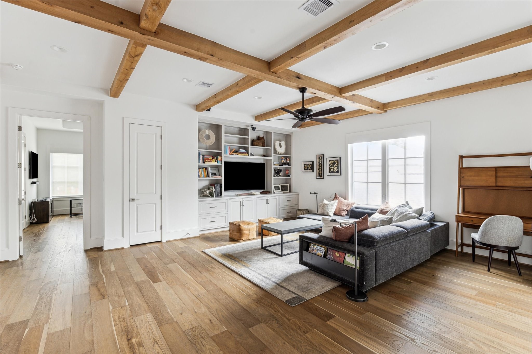 2224 North Boulevard Houston, TX 77098 - Photo 36 of 50 a living room with furniture flat screen tv and a fireplace