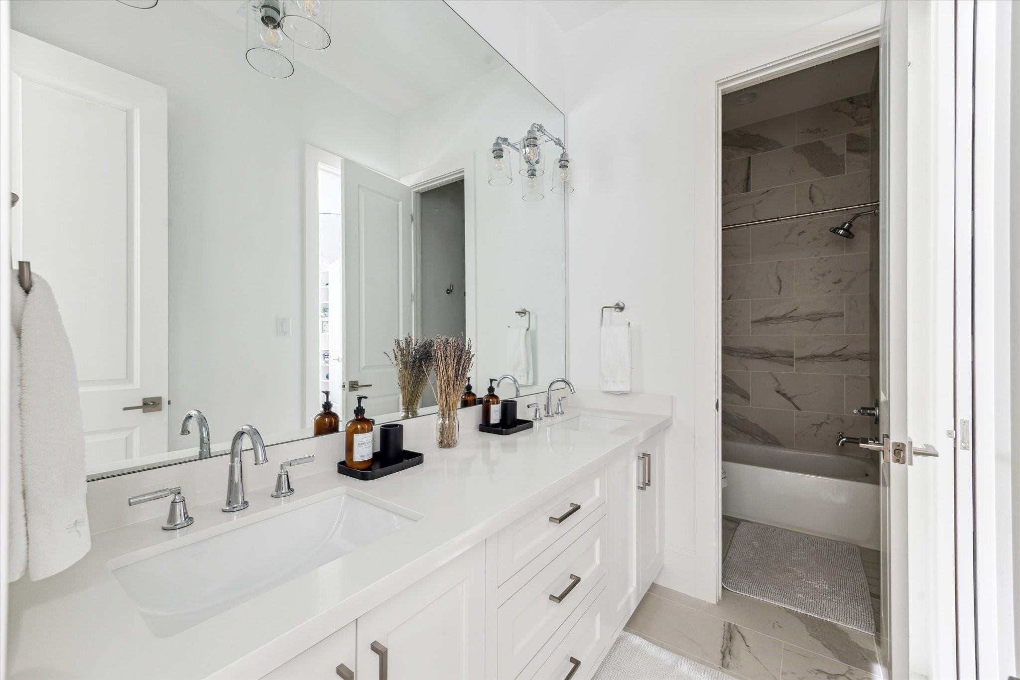 2224 North Boulevard Houston, TX 77098 - Photo 41 of 50 a bathroom with double sink and a mirror