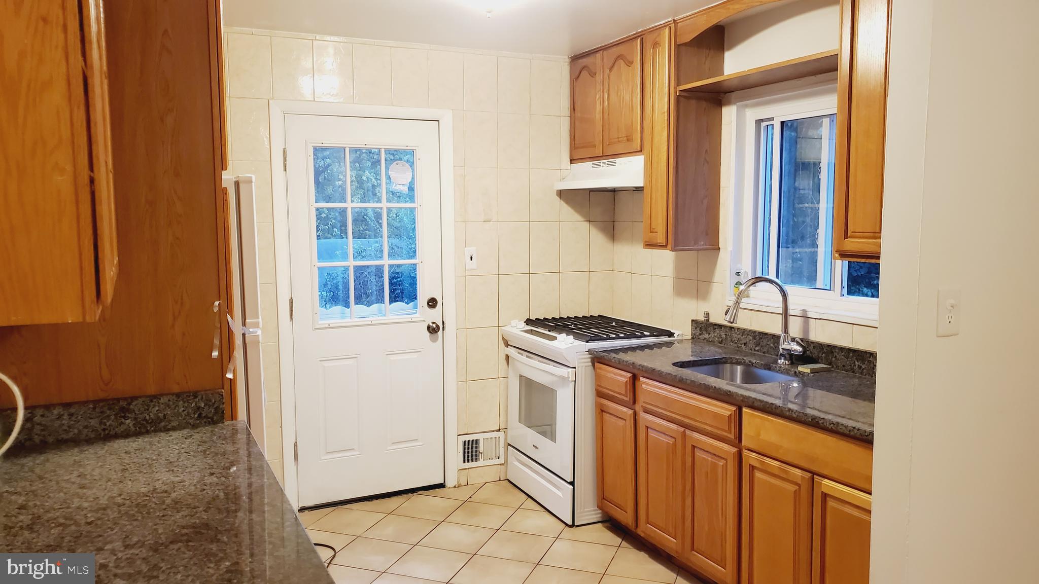 3804 Ralph Road Silver Spring, MD 20906 - Photo 13 of 57 Renovated Kitchen with Dining & New Appliances