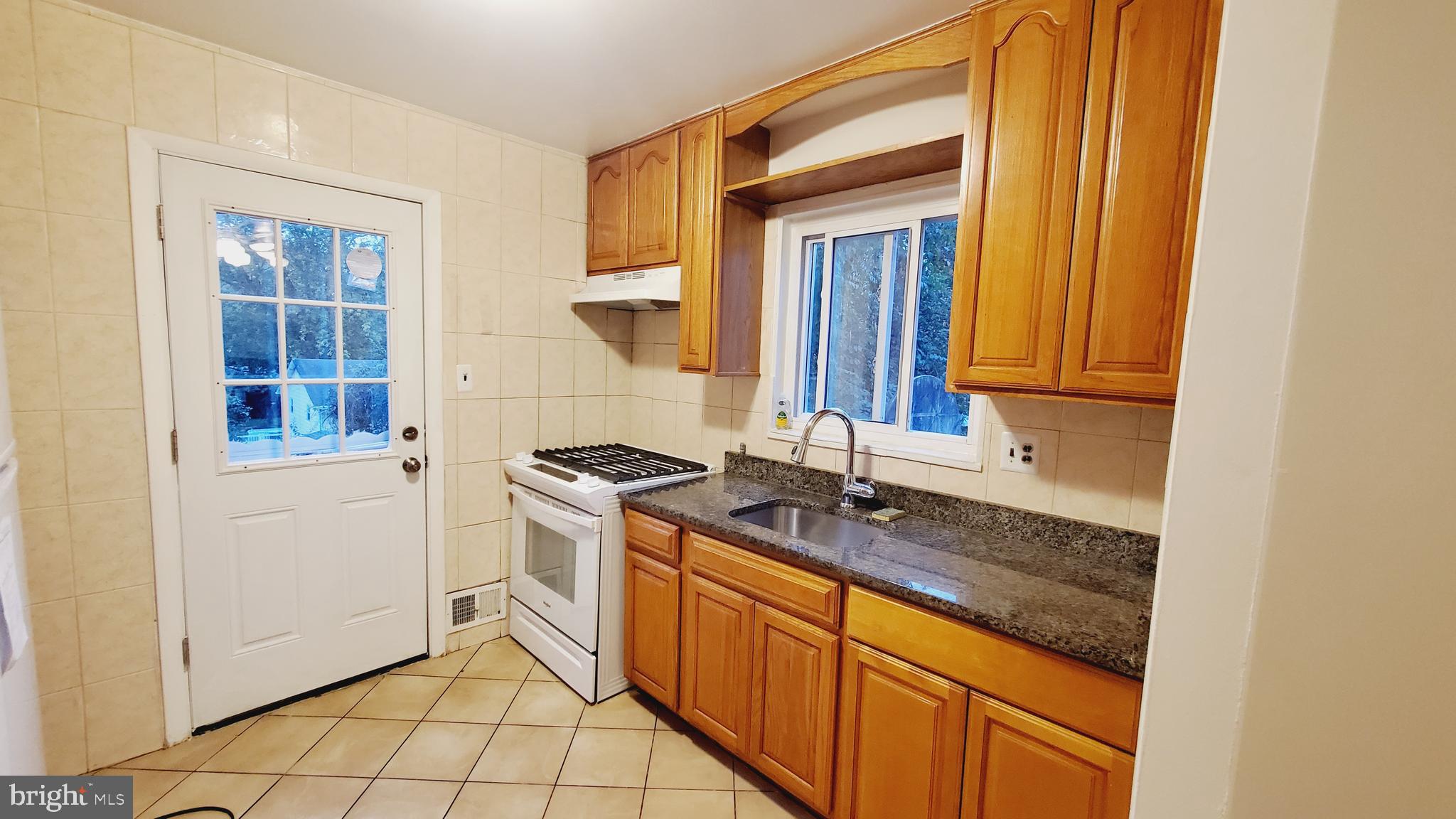3804 Ralph Road Silver Spring, MD 20906 - Photo 15 of 57 Renovated Kitchen with Dining & New Appliances