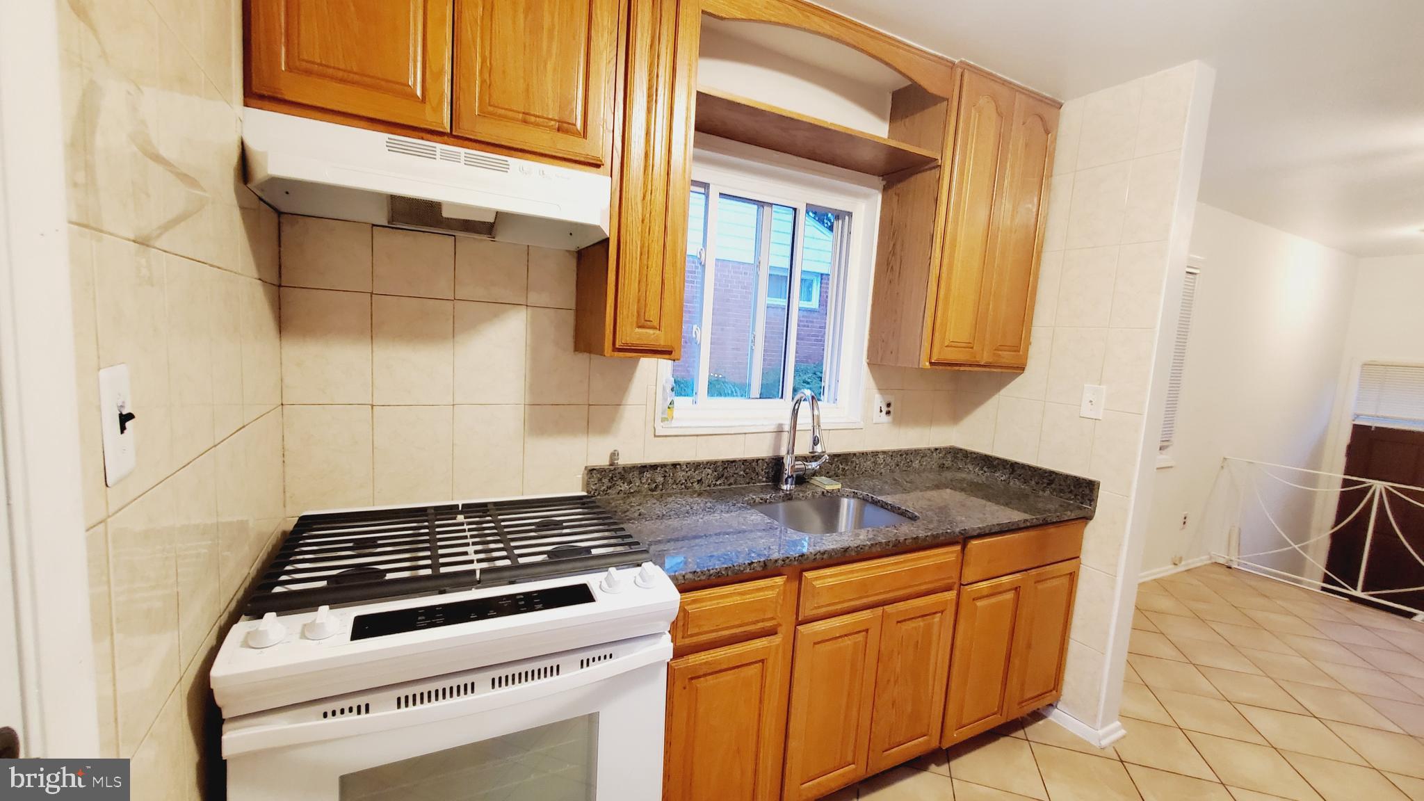 3804 Ralph Road Silver Spring, MD 20906 - Photo 16 of 57 Renovated Kitchen with Dining & New Appliances
