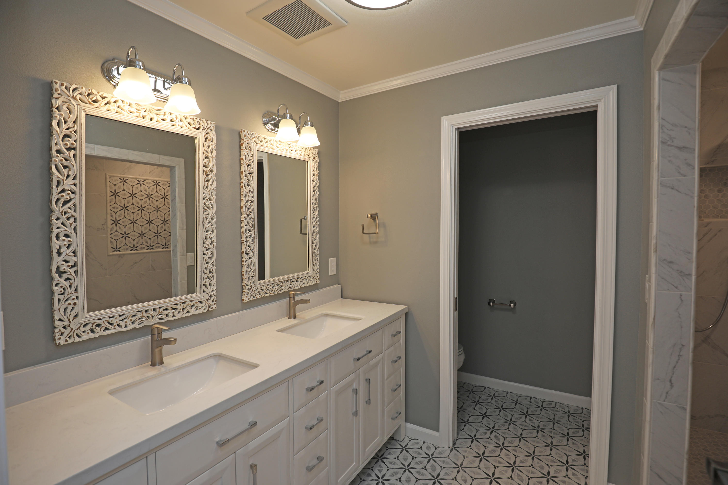 7849 Langlo Ranch Road Goleta, CA 93117 - Photo 12 of 17 a bathroom with double vanity sink and a mirror