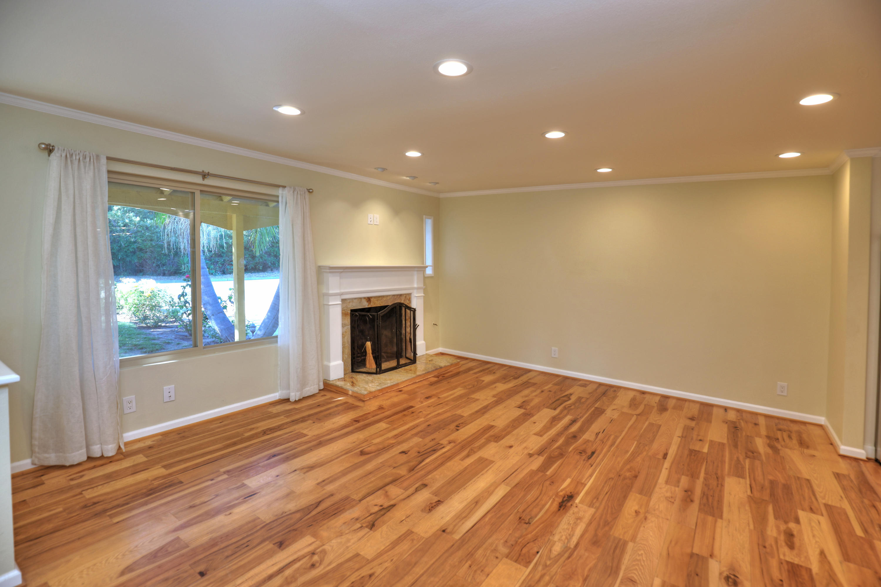 7849 Langlo Ranch Road Goleta, CA 93117 - Photo 2 of 17 a view of empty room with wooden floor and fireplace
