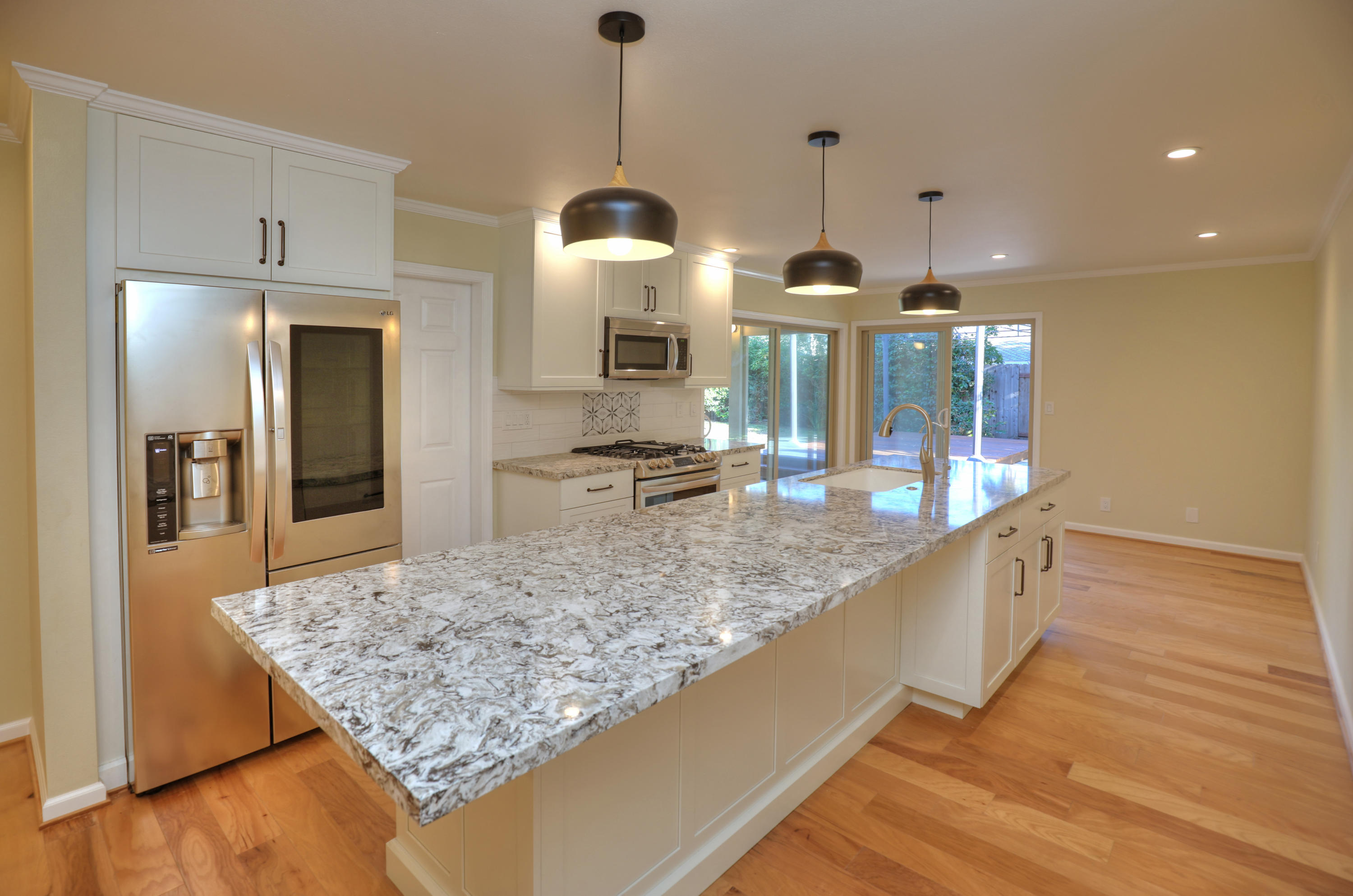 7849 Langlo Ranch Road Goleta, CA 93117 - Photo 3 of 17 a kitchen with center island table and chairs