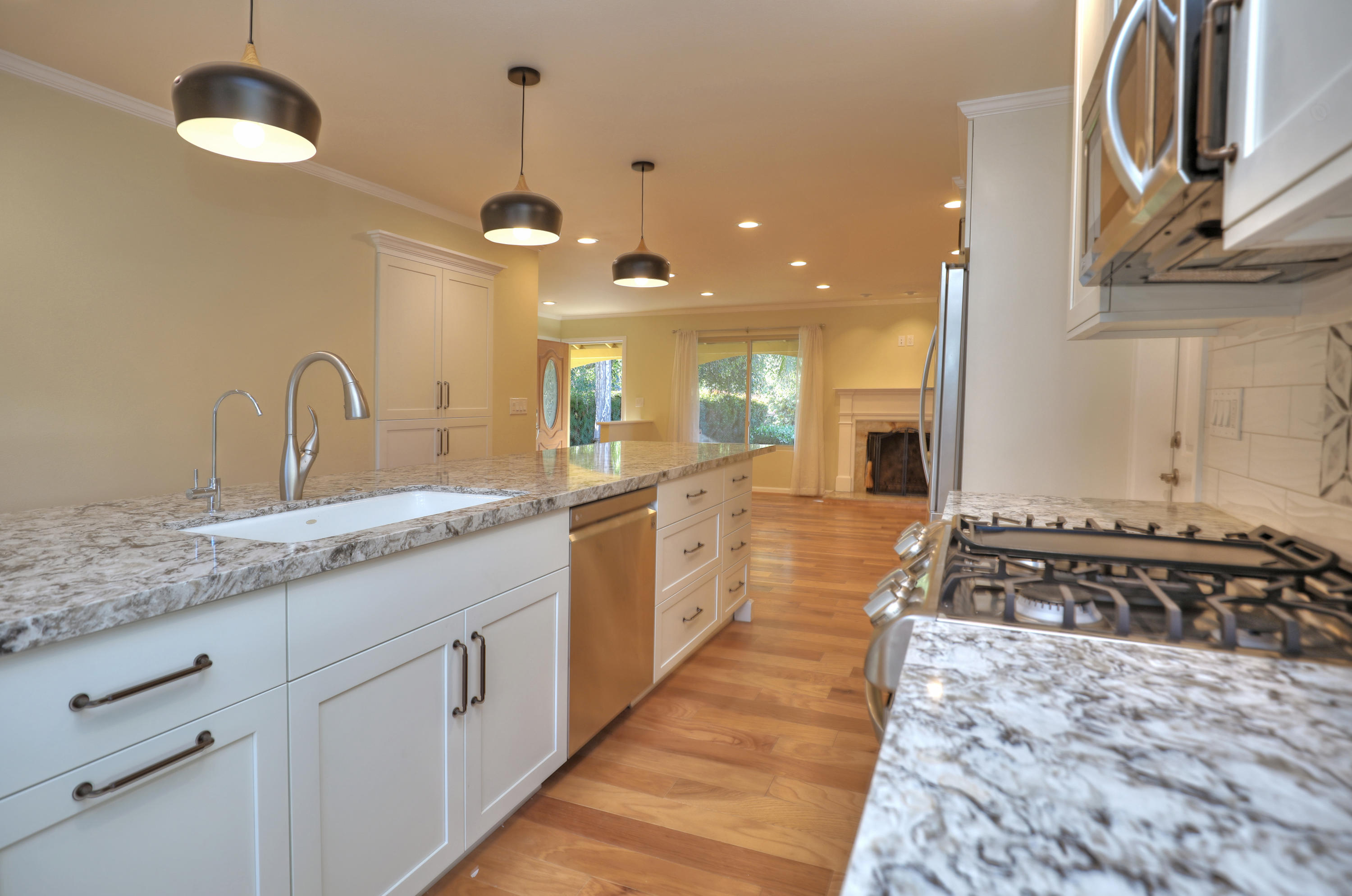 7849 Langlo Ranch Road Goleta, CA 93117 - Photo 5 of 17 a large kitchen with stainless steel appliances granite countertop a stove and a sink