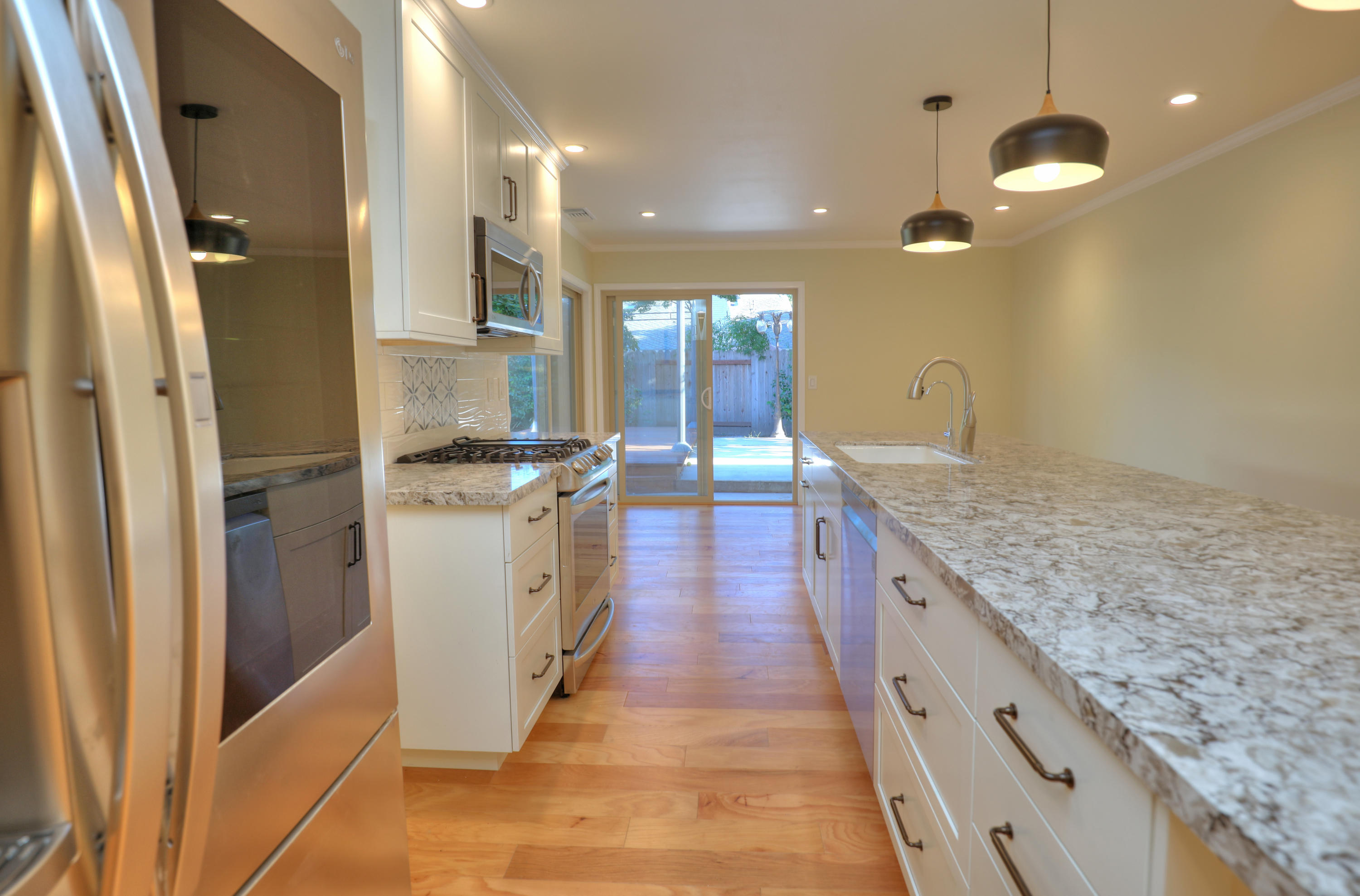 7849 Langlo Ranch Road Goleta, CA 93117 - Photo 6 of 17 a large kitchen with stainless steel appliances granite countertop a sink stove and refrigerator