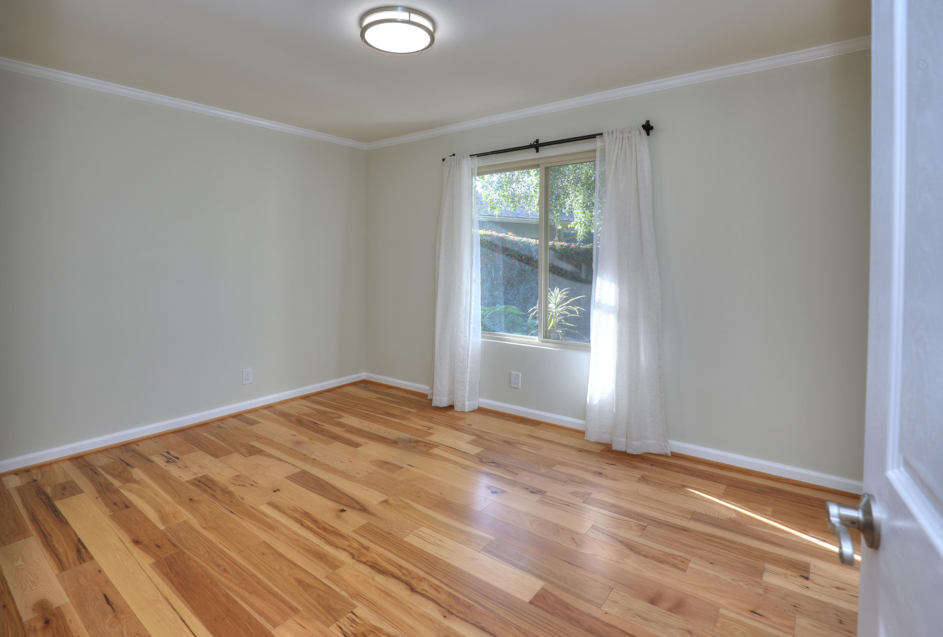 7849 Langlo Ranch Road Goleta, CA 93117 - Photo 7 of 17 a view of empty room with wooden floor and fan