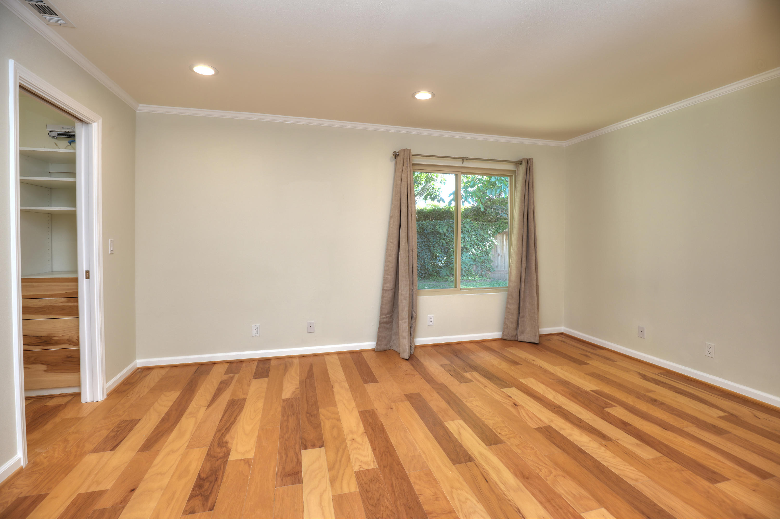 7849 Langlo Ranch Road Goleta, CA 93117 - Photo 9 of 17 a view of an empty room with wooden floor and a window