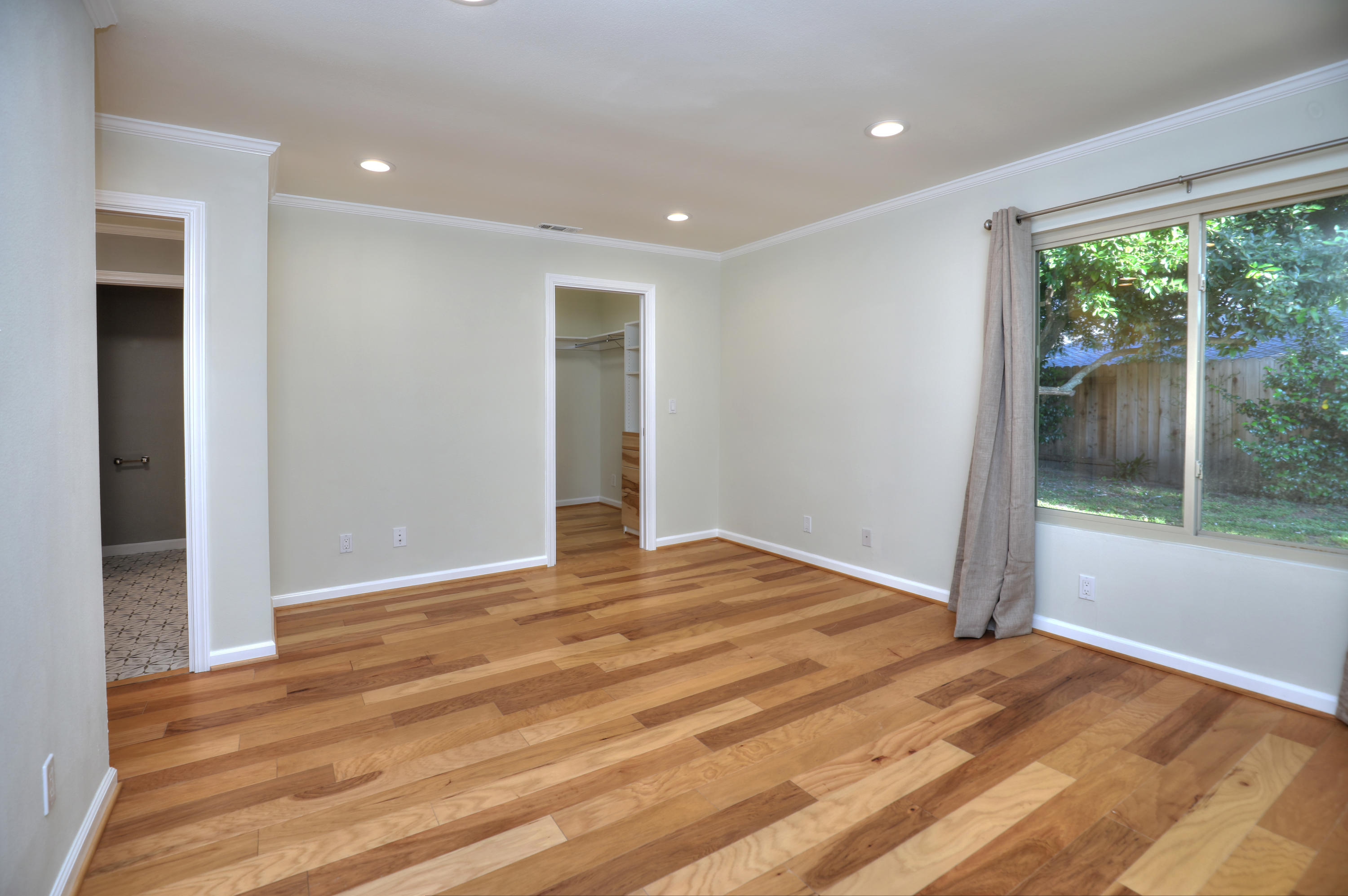 7849 Langlo Ranch Road Goleta, CA 93117 - Photo 10 of 17 a view of empty room with wooden floor and fan