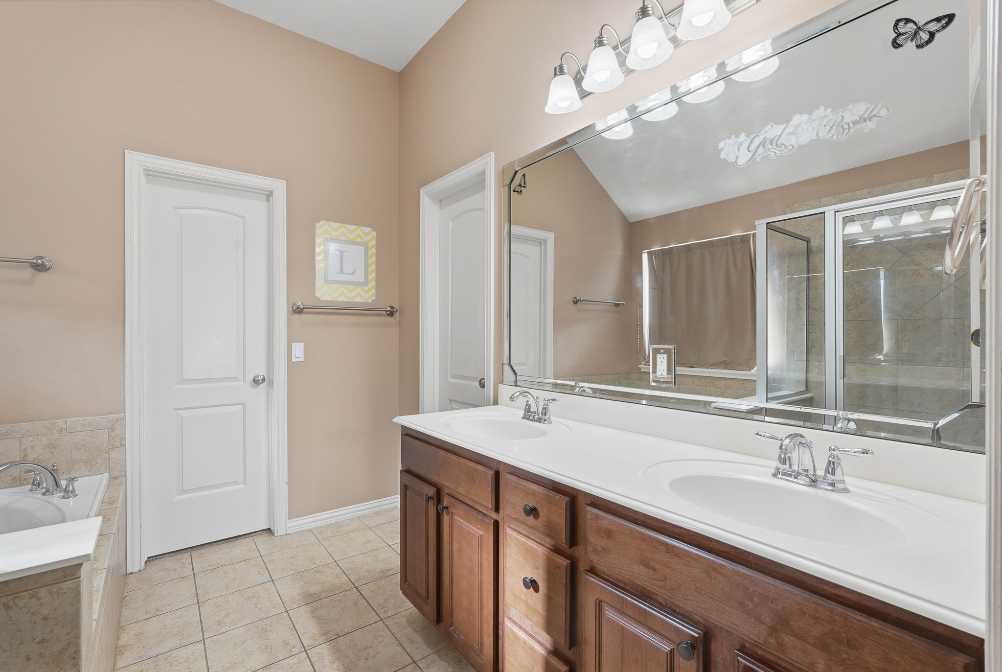 18720 Rosalea Way Montgomery, TX 77356 - Photo 21 of 41 a bathroom with a sink double vanity and a mirror