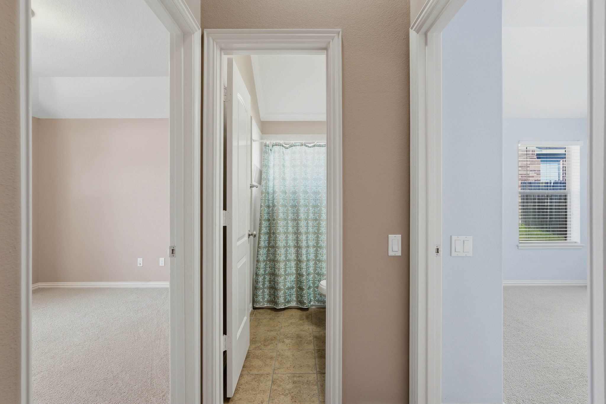 18720 Rosalea Way Montgomery, TX 77356 - Photo 26 of 41 a view of a bathroom from a hallway