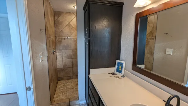 a bathroom with a tub and shower