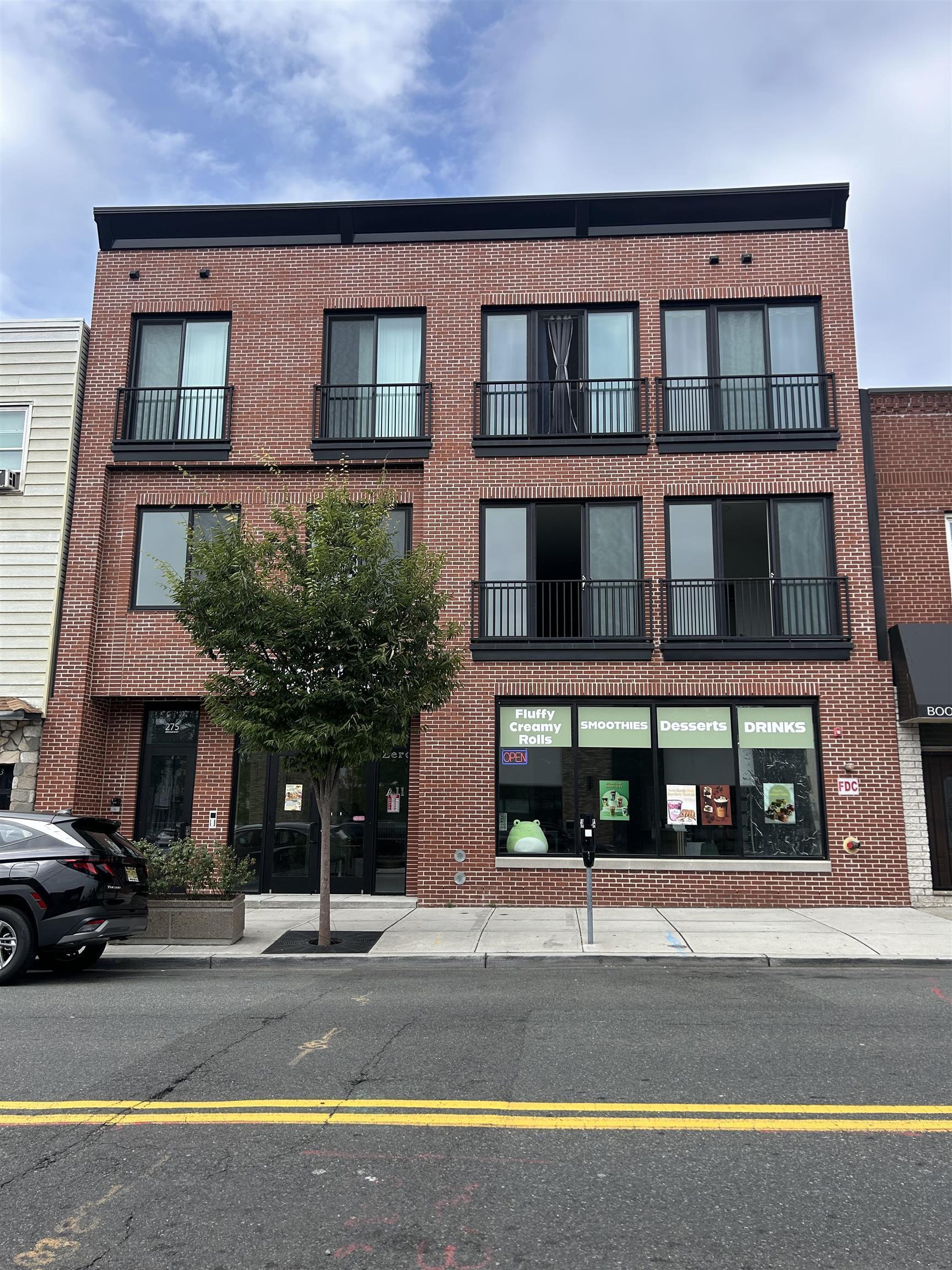 275 Broadway, Unit 302 Bayonne, NJ 07002 - Photo 1 of 13 front view of a building