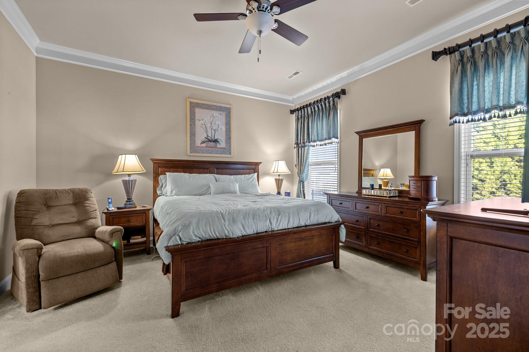 3006 Cricket Lane Lancaster, SC 29720 - Photo 18 of 28 a spacious bedroom with a bed and a chandelier