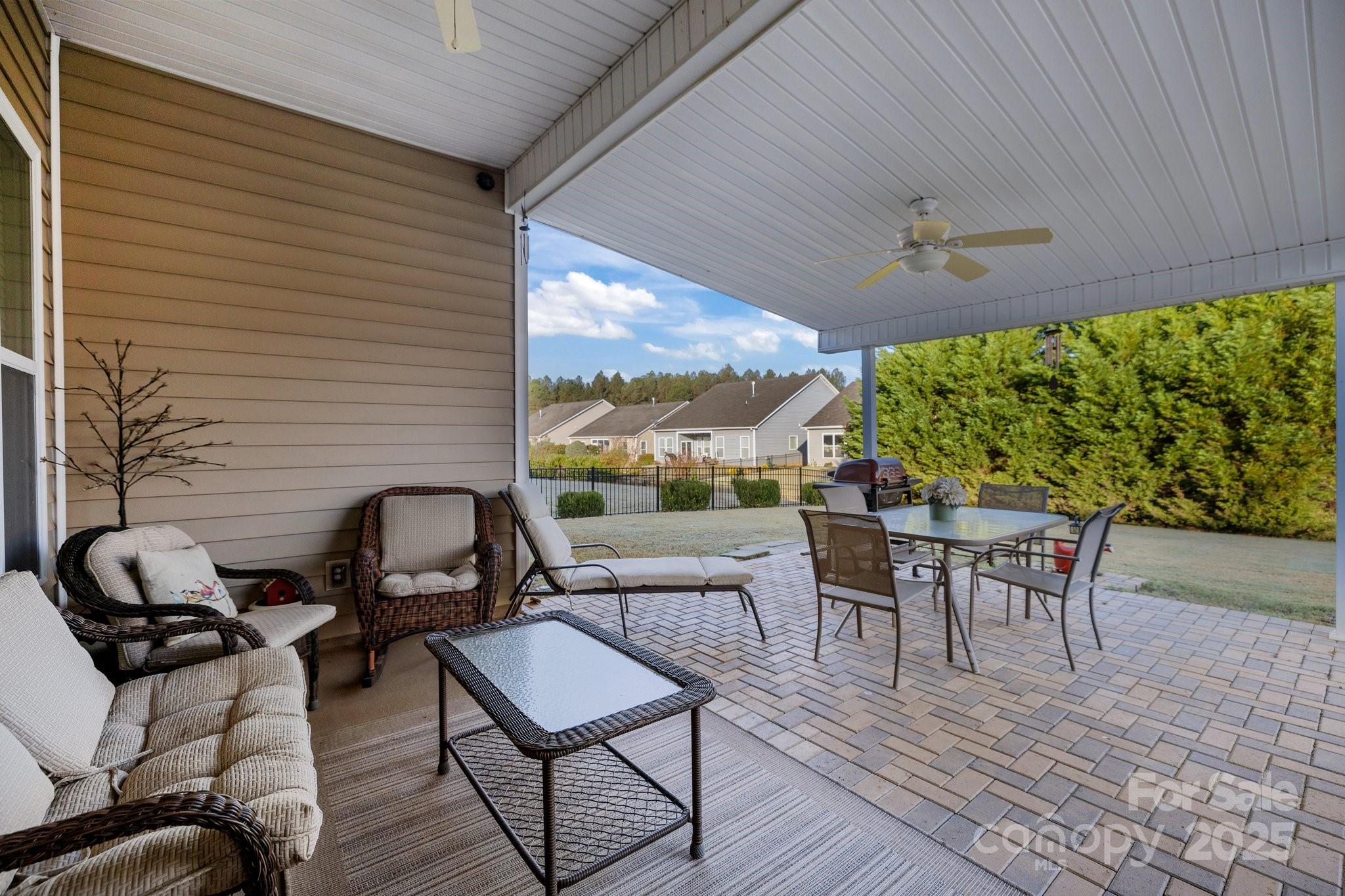 3006 Cricket Lane Lancaster, SC 29720 - Photo 4 of 28 a view of a patio with a dining table and chairs with wooden floor