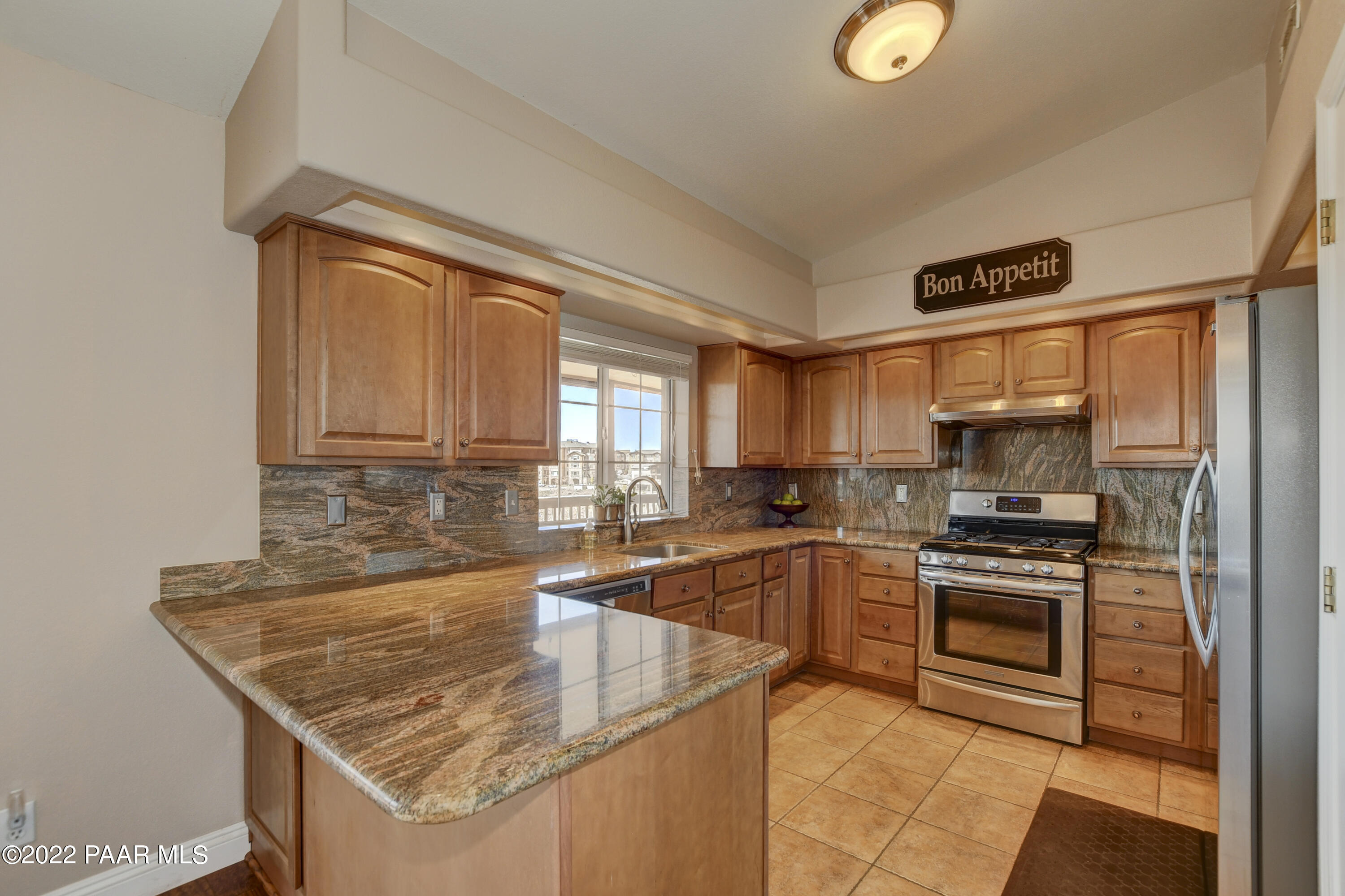 484 Miracle Rider Road Prescott, AZ 86301 - Photo 11 of 32 a kitchen that has a sink and a stove