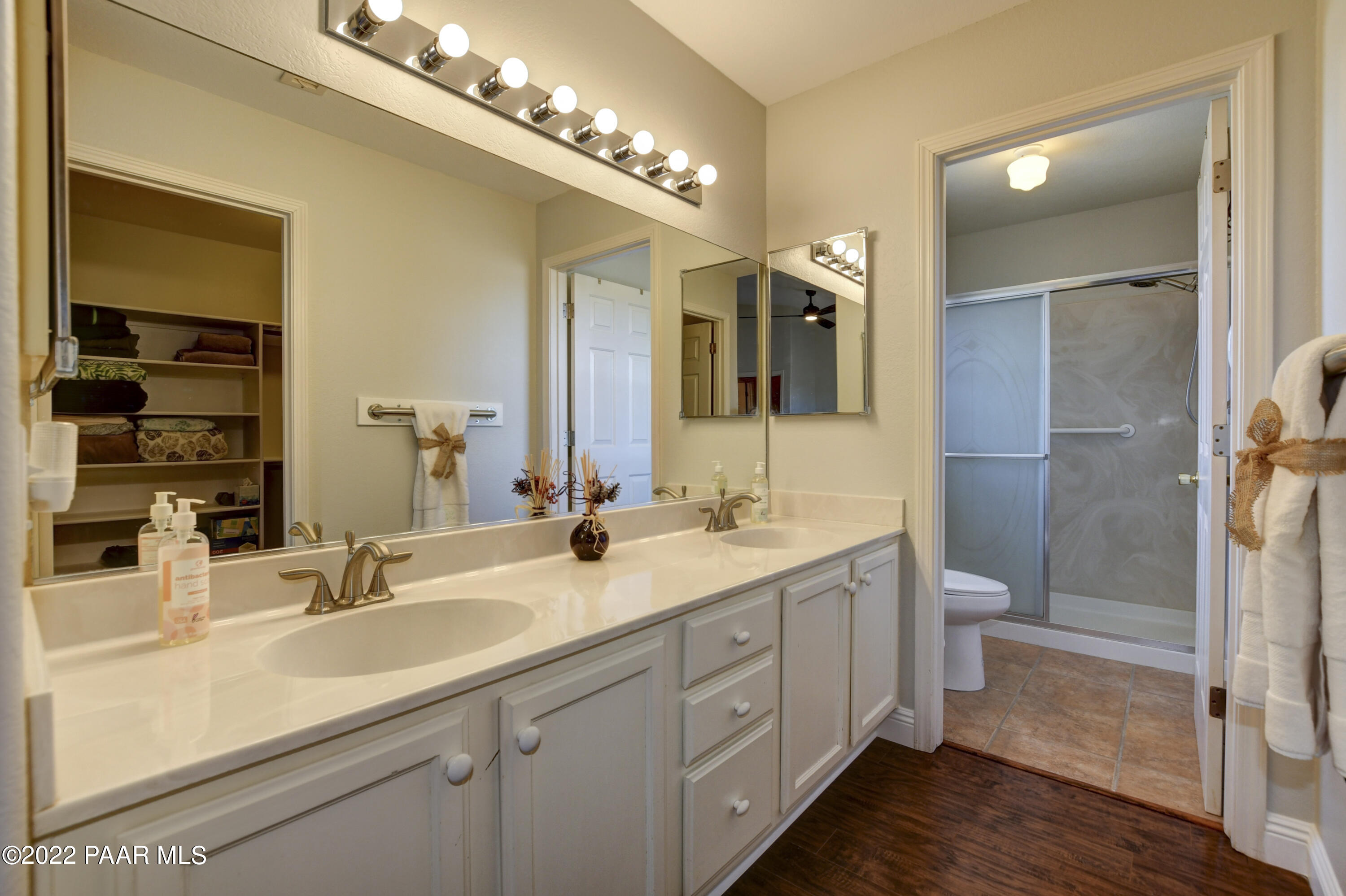 484 Miracle Rider Road Prescott, AZ 86301 - Photo 18 of 32 a bathroom with a double vanity sink and a mirror