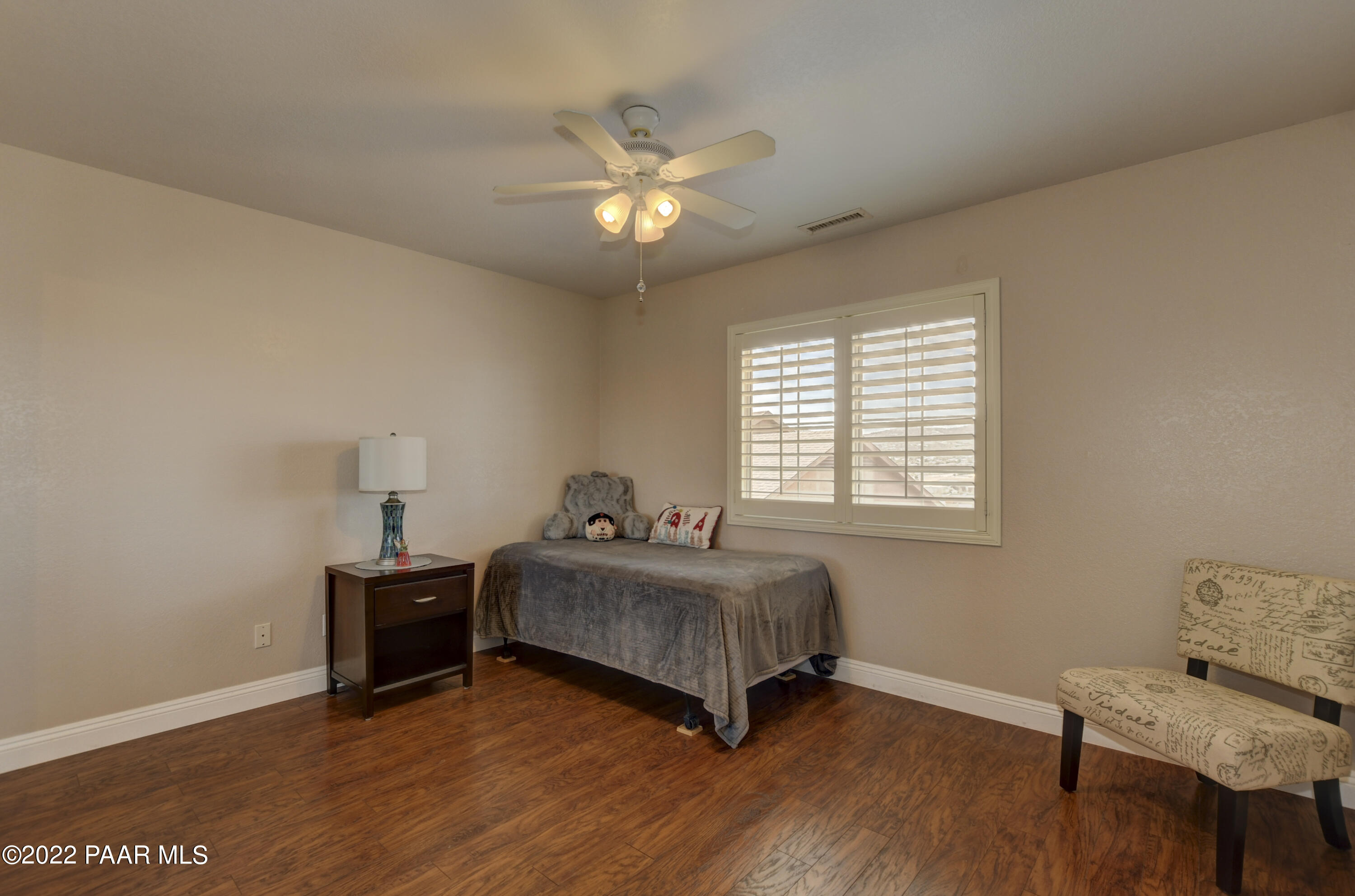 484 Miracle Rider Road Prescott, AZ 86301 - Photo 20 of 32 a spacious bedroom with a bed and a window