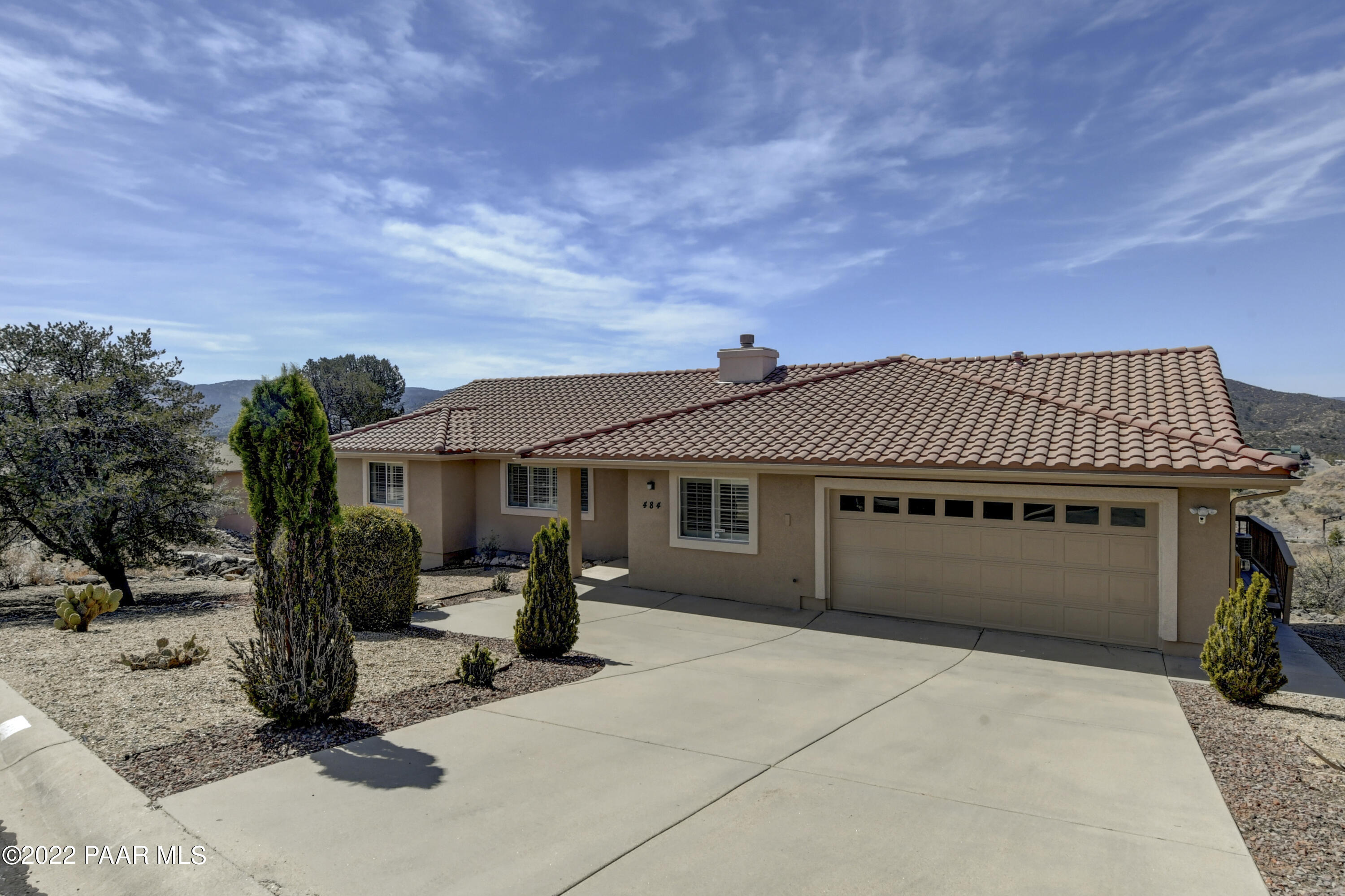 484 Miracle Rider Road Prescott, AZ 86301 - Photo 2 of 32 a front view of a house with a garden