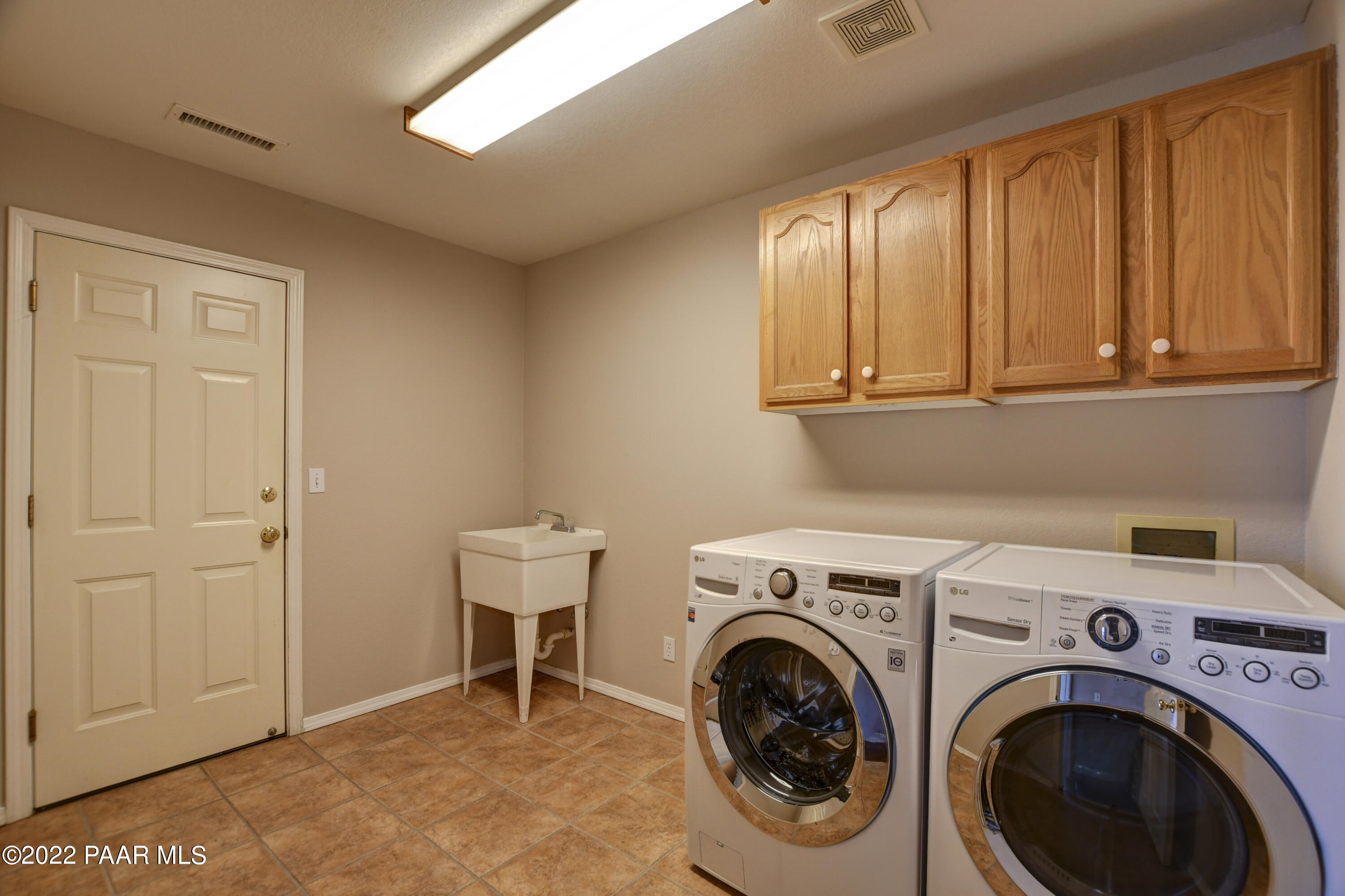 484 Miracle Rider Road Prescott, AZ 86301 - Photo 24 of 32 a utility room with dryer and washer