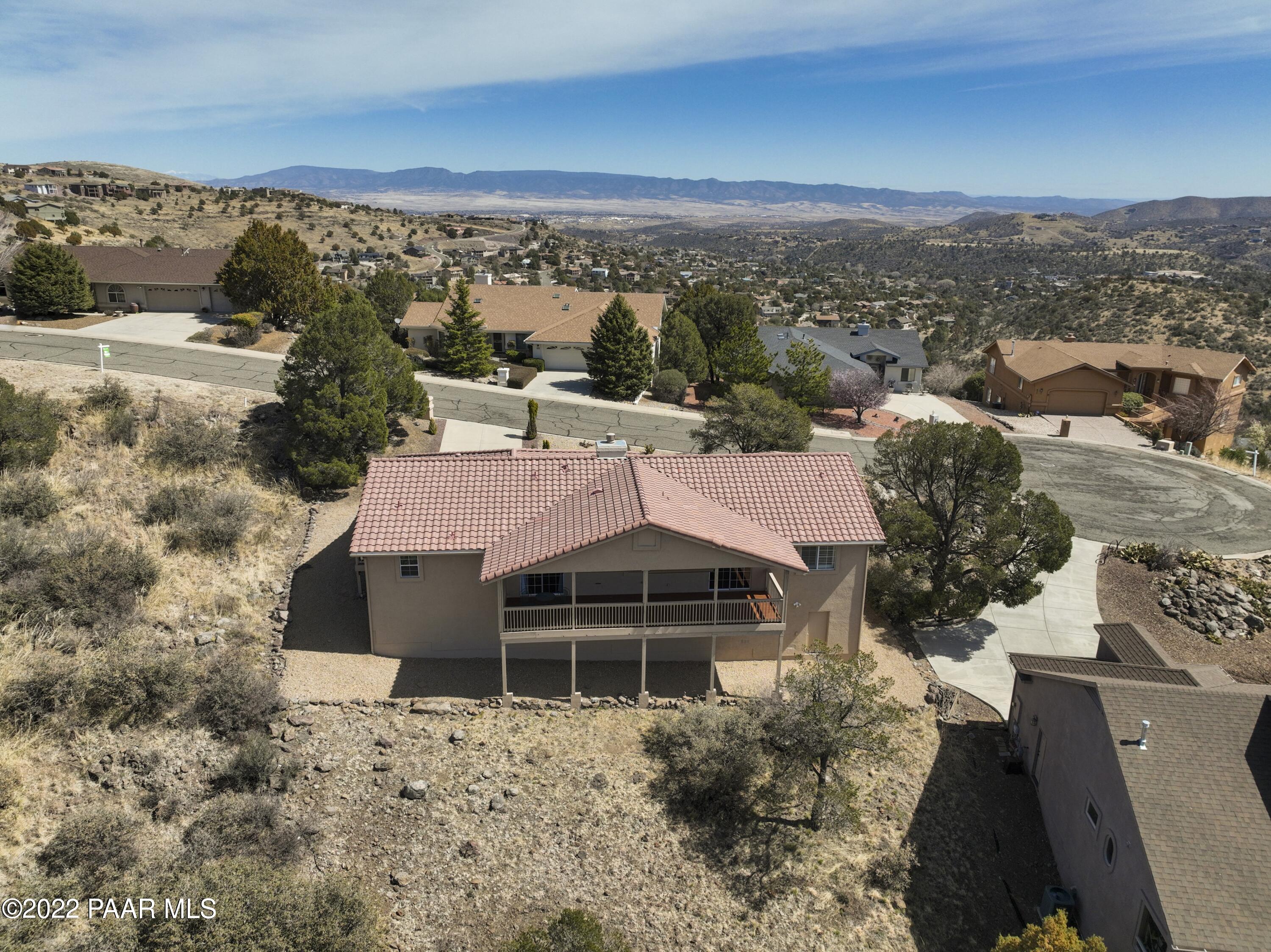 484 Miracle Rider Road Prescott, AZ 86301 - Photo 26 of 32 a view of a terrace with a garden