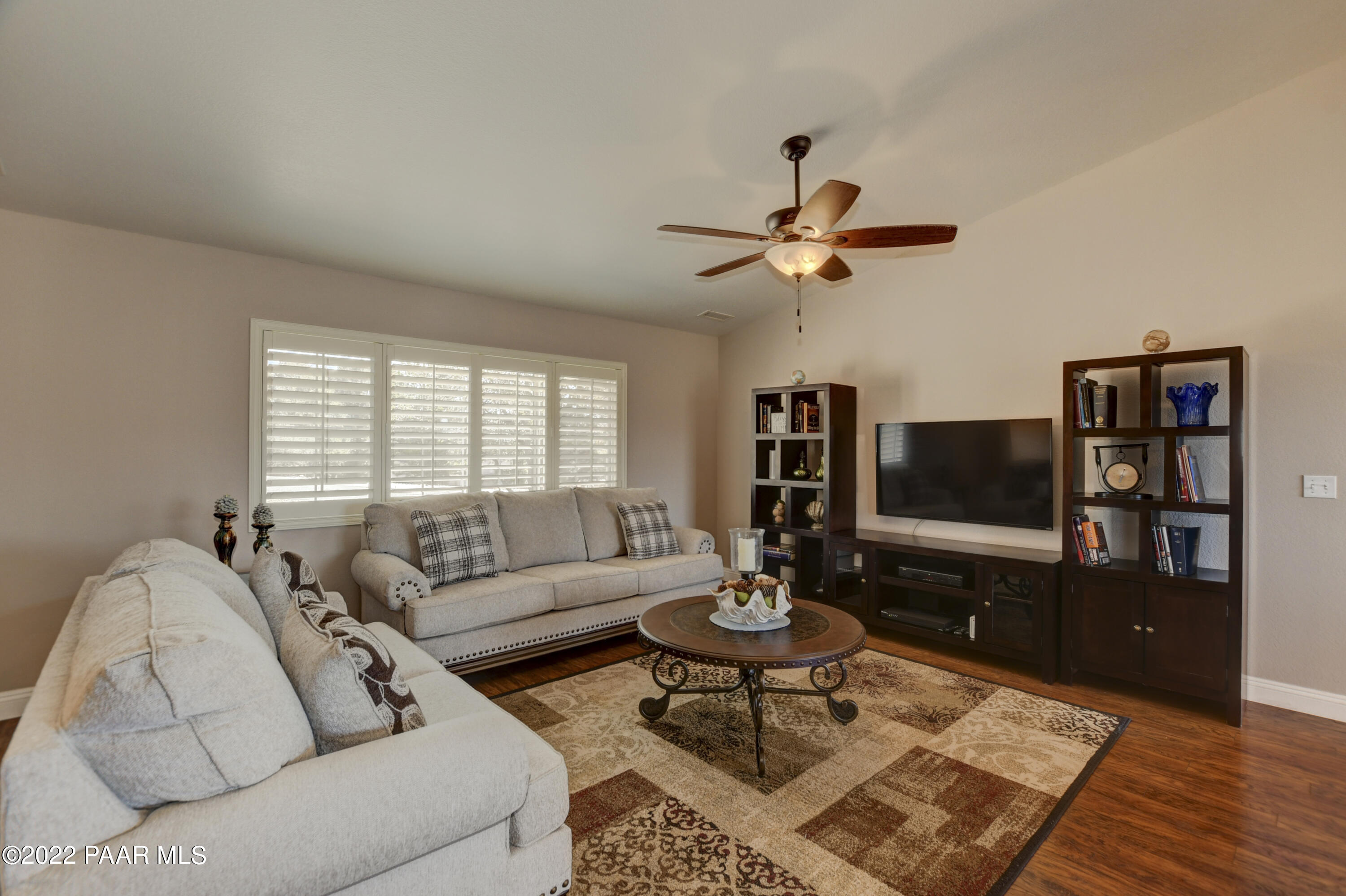 484 Miracle Rider Road Prescott, AZ 86301 - Photo 7 of 32 a living room with furniture a rug and a flat screen tv