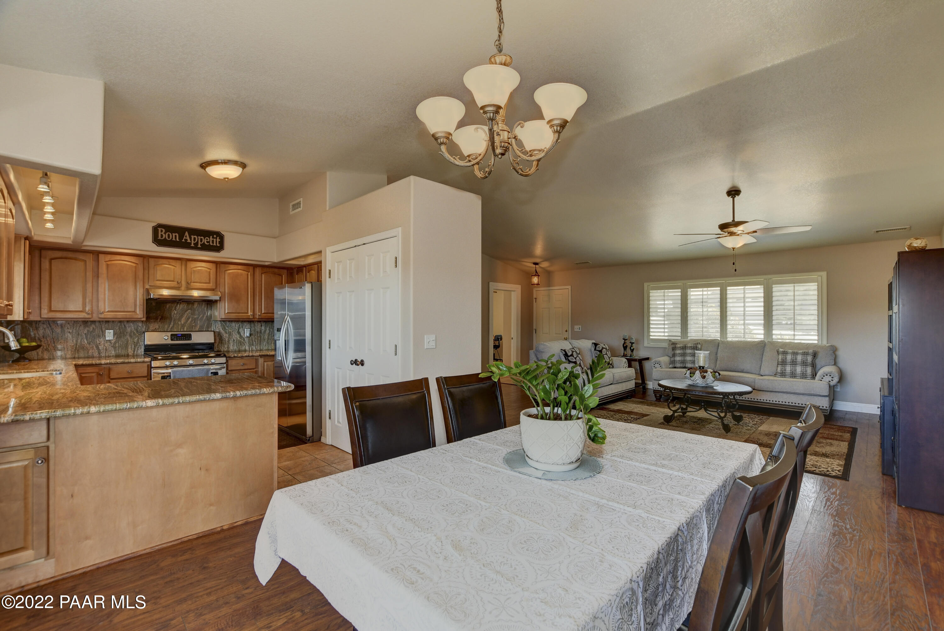 484 Miracle Rider Road Prescott, AZ 86301 - Photo 9 of 32 a large kitchen with a table and chairs