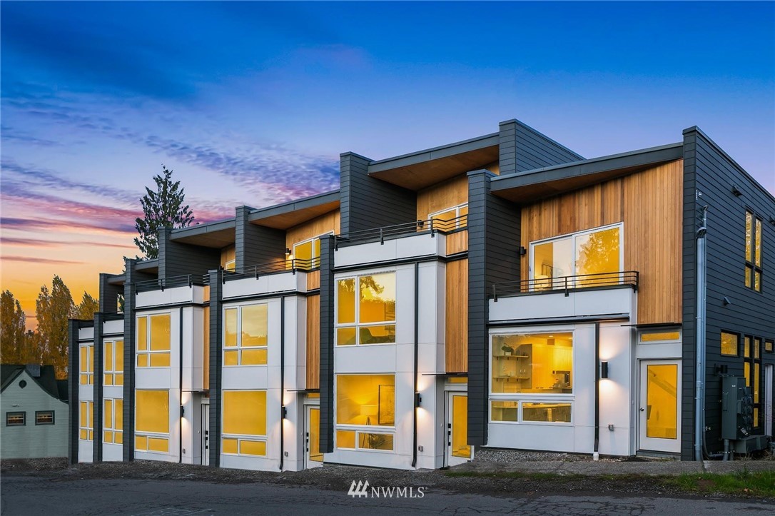 a front view of residential houses with brick walls