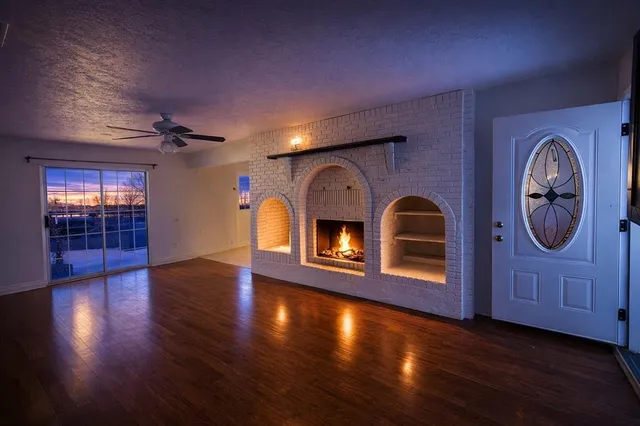 a view of an entryway with wooden floor