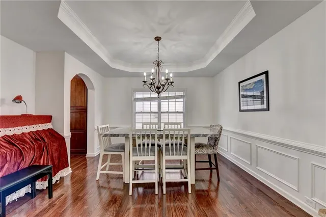 a kitchen with stainless steel appliances granite countertop a sink a stove and cabinets