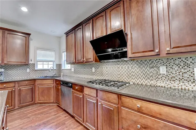 a large open kitchen with a table and chairs