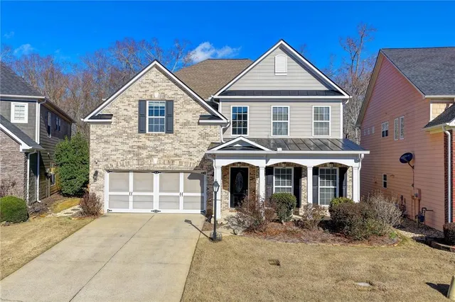 a bathroom with a sink mirror toilet and bathtub