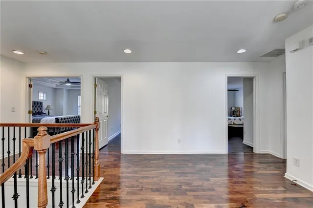 a bathroom with a granite countertop sink a large mirror and a window