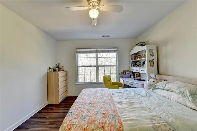 an aerial view of a house with outdoor space and sitting area