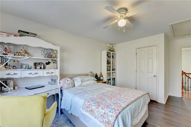an aerial view of a house with outdoor space and trees