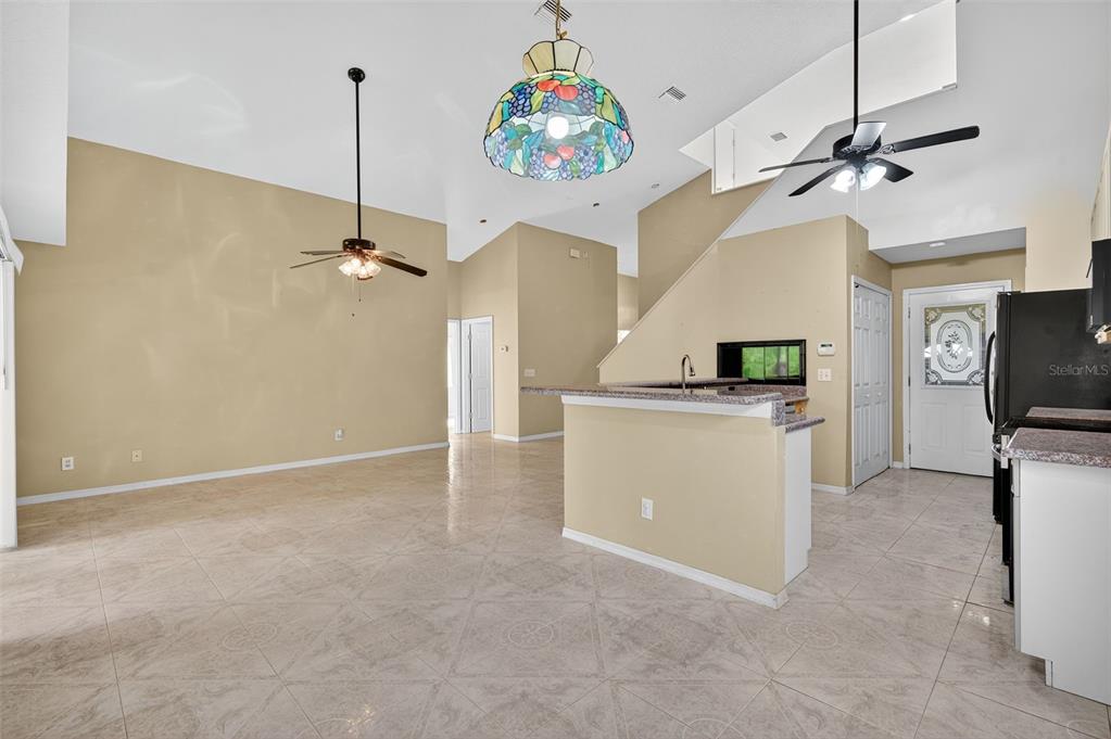 148 Lookout Drive Apollo Beach, FL 33572 - Photo 26 of 71 a view of a kitchen with furniture and a ceiling fan
