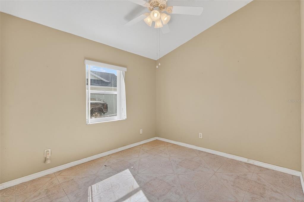 148 Lookout Drive Apollo Beach, FL 33572 - Photo 41 of 71 an empty room with a chandelier fan and windows