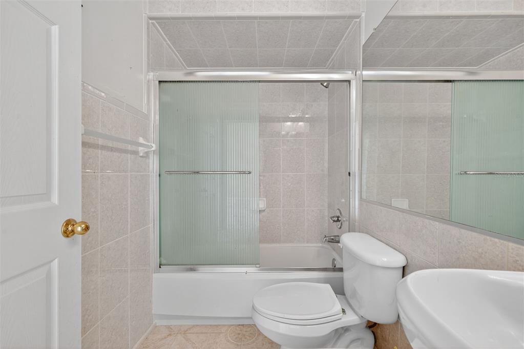 148 Lookout Drive Apollo Beach, FL 33572 - Photo 44 of 71 a white toilet sitting next to a bath tub