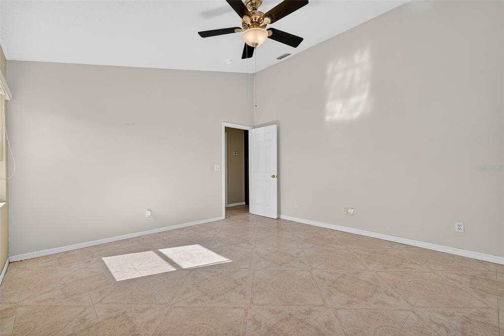 148 Lookout Drive Apollo Beach, FL 33572 - Photo 49 of 71 an empty room with ceiling fan and window