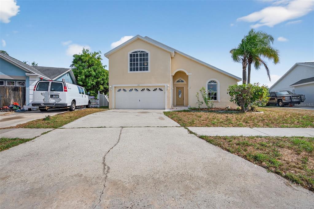 148 Lookout Drive Apollo Beach, FL 33572 - Photo 5 of 71 a house with palm tree in front of it