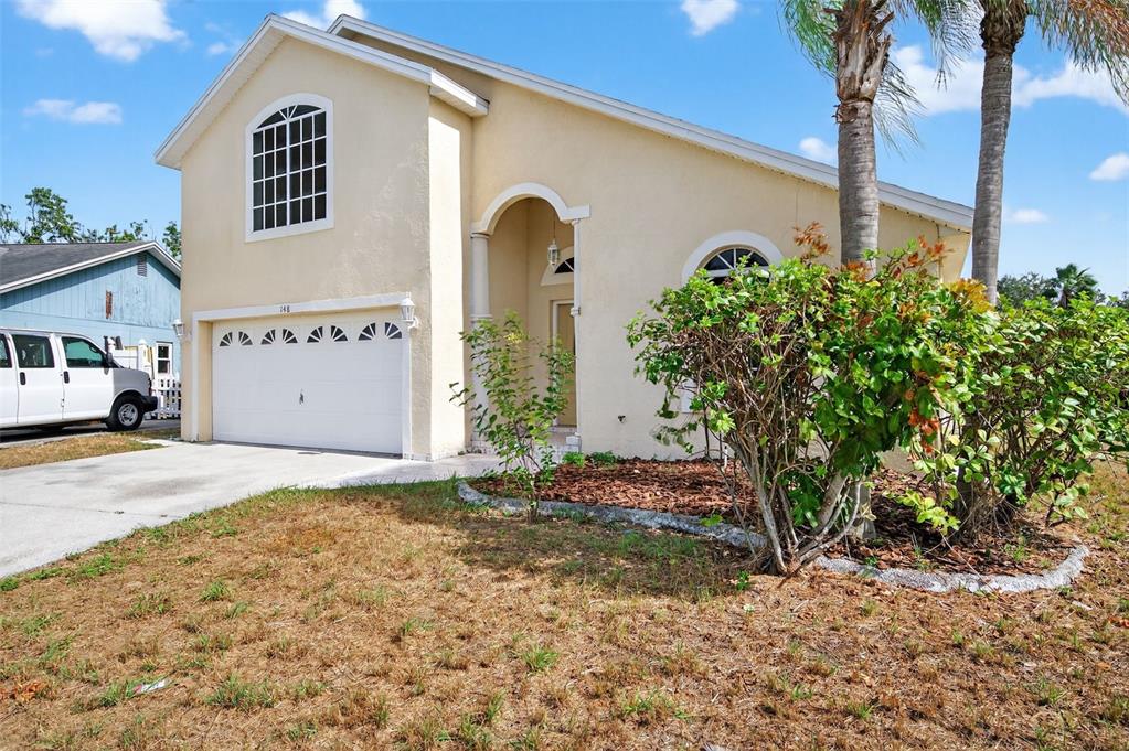 148 Lookout Drive Apollo Beach, FL 33572 - Photo 7 of 71 a view of a front of a house with a yard