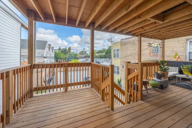 a view of a balcony with chairs